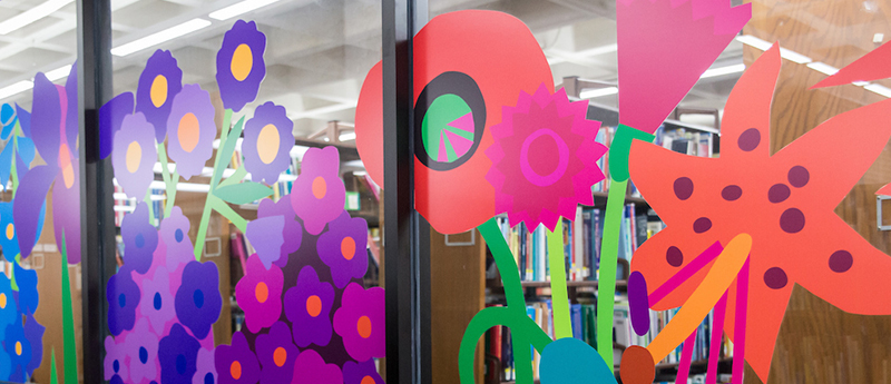 Painted flowers on glass doors to library