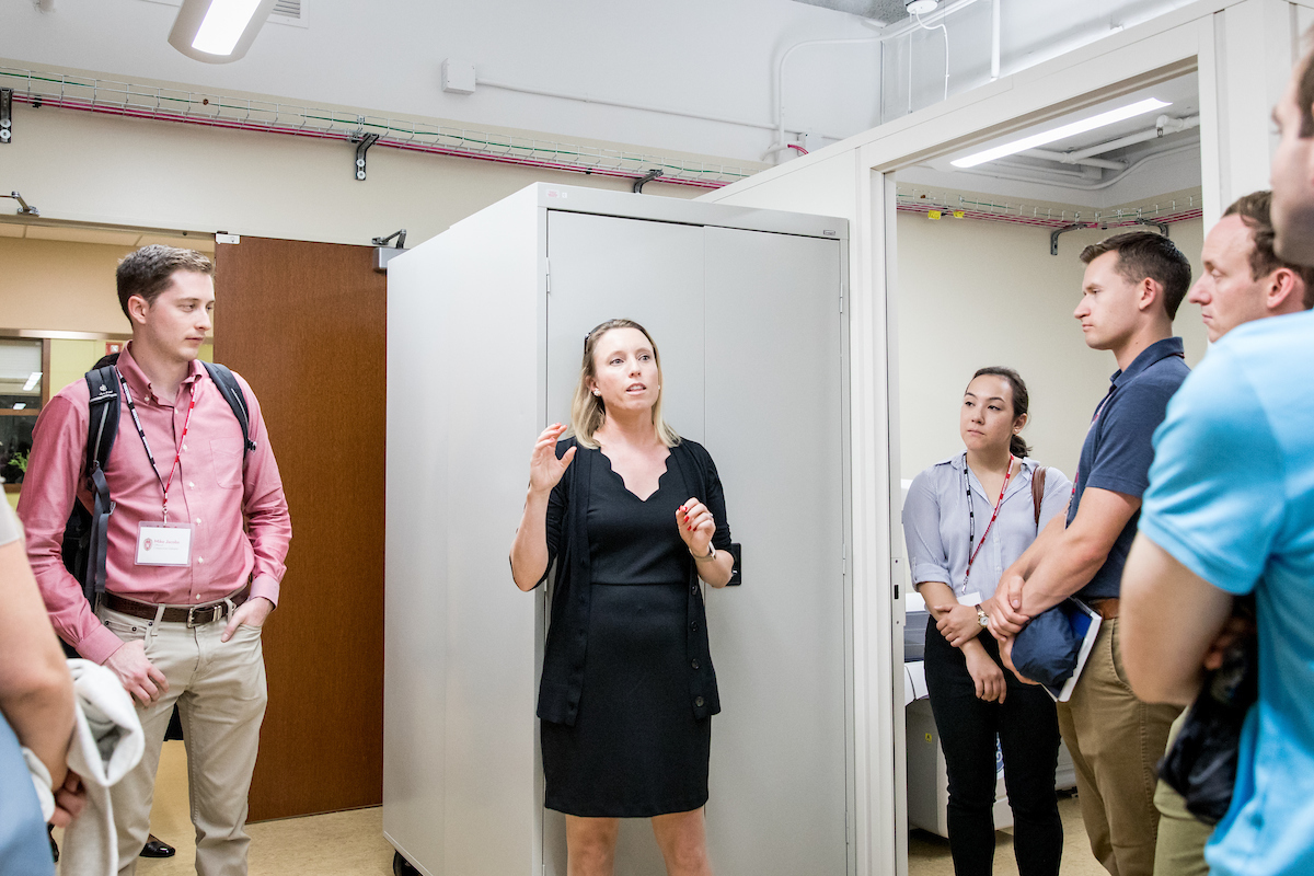 Lisa Cadmus-Bertram (left) explains her research to staff members of Wisconsin's congressional representatives who were visiting campus on Aug. 20.