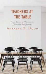 book cover showing table and chairs with title teachers at the table