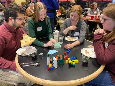 Workshop attendees do a guided-play task with blocks. From left, Noah Gill, Kelly Quirk, Heidi Schultz and Renae DeBarbieri.